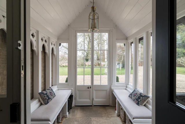 Step into the porch and glance up at the decorative woodwork, which was once part of pews from St Peter’s