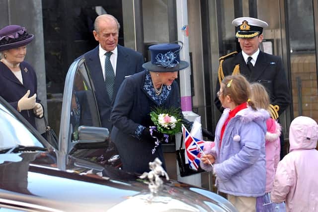 Three children presented the Queen with posies at the start of her visit to Bedfordshire in 2006