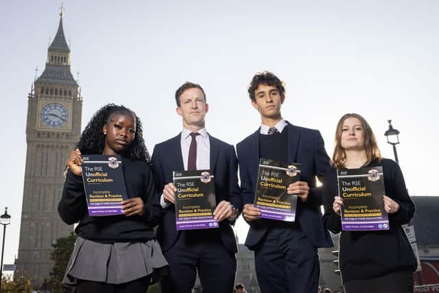 Students Eni (first name only), Labour MP Alistair Strathern, Harry Terruli and Caitlin (first name only) with 'The Unofficial Curriculum' in Parliament Square Gardens, London. Photo: Matt Alexander/Assignments/the Press Association