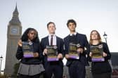 Students Eni (first name only), Labour MP Alistair Strathern, Harry Terruli and Caitlin (first name only) with 'The Unofficial Curriculum' in Parliament Square Gardens, London. Photo: Matt Alexander/Assignments/the Press Association