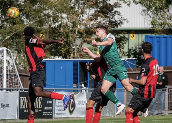 Tom Coles heads home Biggleswade Town's opener against Thame. Photo: Guy Wills Sports Photography.