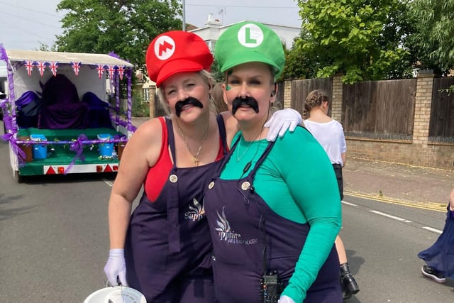 Costumed walkers joined the parade to collect donations - including this pair dressed as Mario and Luigi