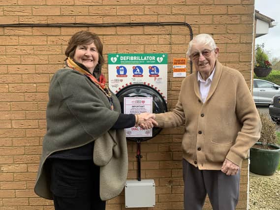 Sandy mayor Cllr Joanna Hewitt thanks local resident Mick Reynolds for his generous defibrillator donation. It brings the town's complement of these life saving devices to five.