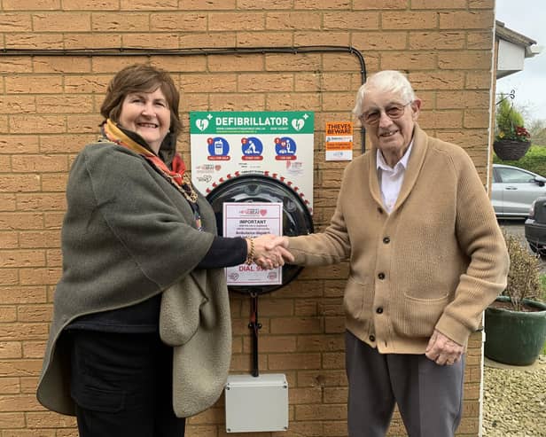 Sandy mayor Cllr Joanna Hewitt thanks local resident Mick Reynolds for his generous defibrillator donation. It brings the town's complement of these life saving devices to five.