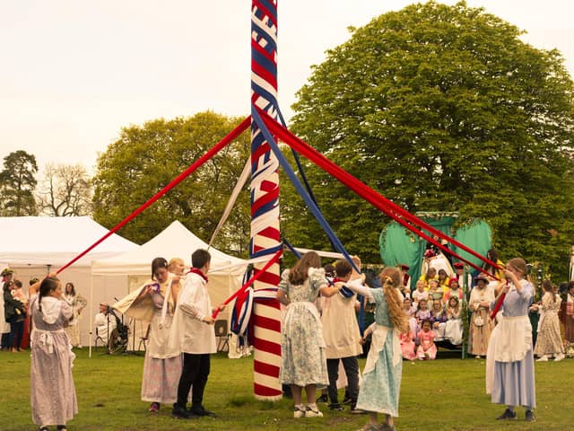 Adults dance round the Maypole. Pic: Willow Photography