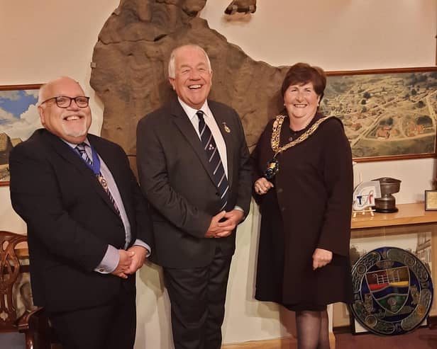 Outgoing mayor Cllr Martin Pettitt (centre) congratulates new deputy mayor Cllr Paul Sharman and mayor Cllr Joanna Hewitt.
