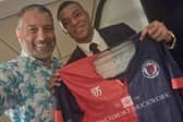 Paris Saint-Germain star Kylian Mbappe shows off the Biggleswade United colours with chairman Guillem Balague