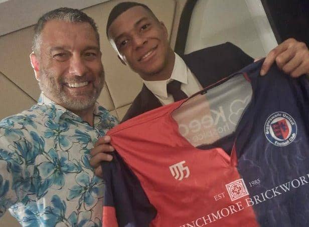 Paris Saint-Germain star Kylian Mbappe shows off the Biggleswade United colours with chairman Guillem Balague