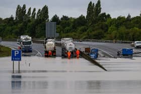 Efforts to remove flood water from the A421 after it flooded in September 2024
