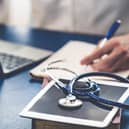 File photo of a doctor working in an office.