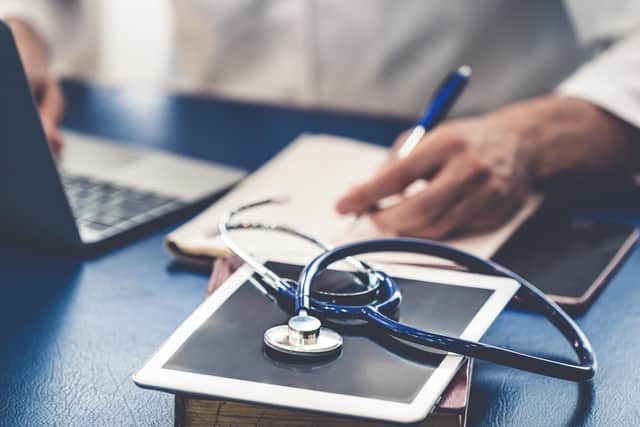 File photo of a doctor working in an office.