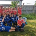 Youngsters from Potton Utd YFC celebrating getting new equipment