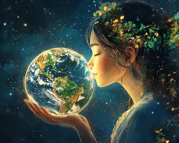 Showing love for Mother Earth (photo: Adobe)