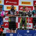 Lewis Smart on the top step of the podium with his dad Gavin taking the team award. Photo: Colin Port Images.