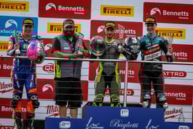 Lewis Smart on the top step of the podium with his dad Gavin taking the team award. Photo: Colin Port Images.