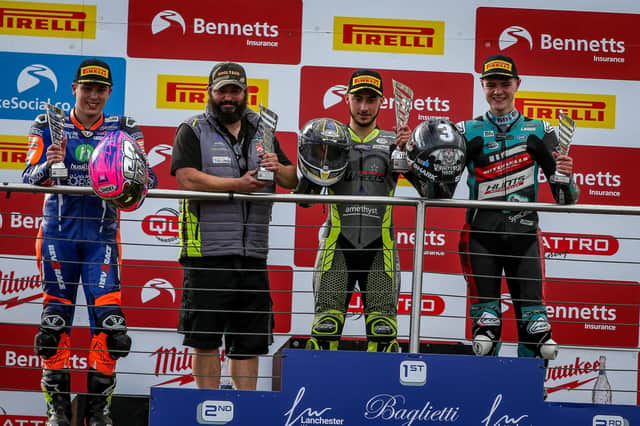 Lewis Smart on the top step of the podium with his dad Gavin taking the team award. Photo: Colin Port Images.