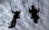 File photo of children playing on swings i