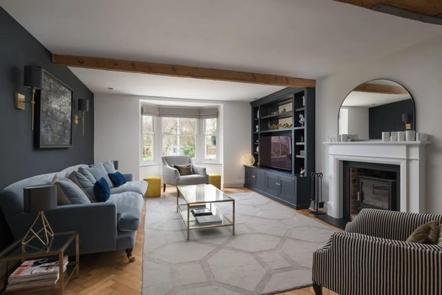 This lovely, bay-windowed sitting room measures 13ft7in by 18ft 6in