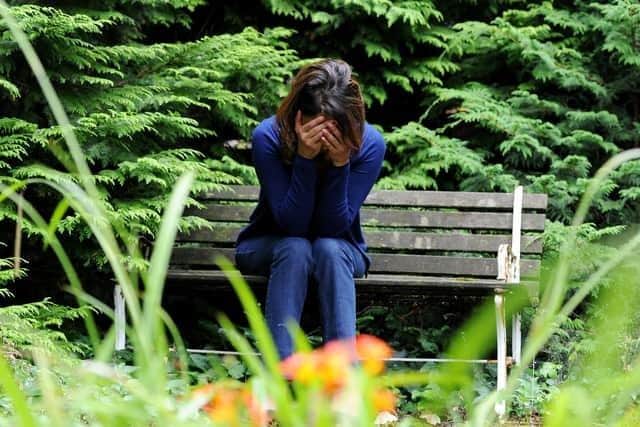 A woman showing signs of depression. Picture: Anna Gowthorpe/PA