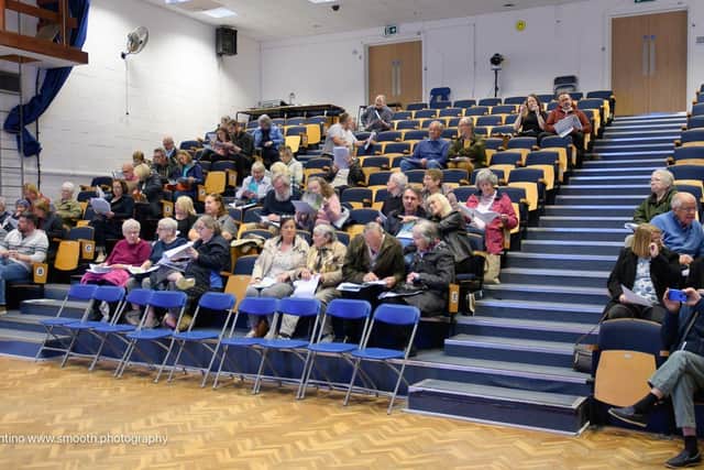 Residents seated during the meeting
