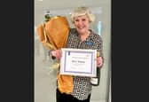 Mary Tolladay with her certificate and flowers. Image: Penrose Care Home.