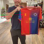 Alan Shearer with the Biggleswade United shirt.