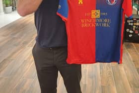 Alan Shearer with the Biggleswade United shirt.