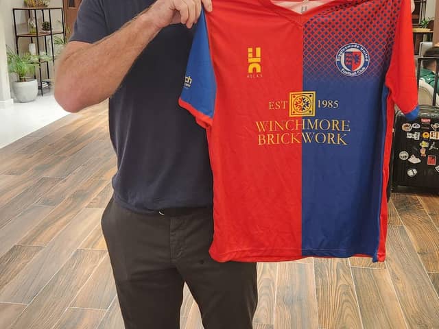 Alan Shearer with the Biggleswade United shirt.