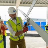 Sandy Secondary School pupils tighten the final bolt on the steel frame of the new teaching block. Picture: Central Bedfordshire Council