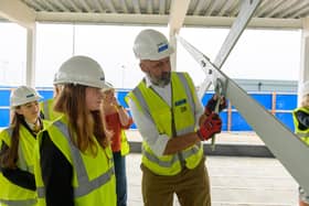 Sandy Secondary School pupils tighten the final bolt on the steel frame of the new teaching block. Picture: Central Bedfordshire Council