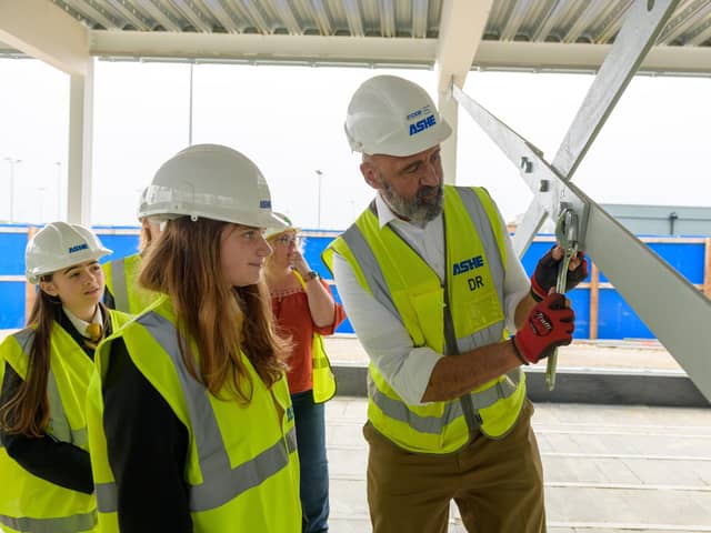 Sandy Secondary School pupils tighten the final bolt on the steel frame of the new teaching block. Picture: Central Bedfordshire Council