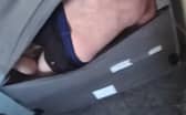 Police found the man hiding in the base of his sofa. Picture: Bedfordshire Police footage still