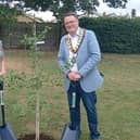 Renate Tonecker-Bos, the deputy mayor of Erlensee, and Biggleswade Mayor Jonathan Woodhead take part in a ceremonial planting of a ginkgo tree at Kitelands Recreation Ground