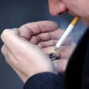 PICTURE POSED BY A MODEL File photo dated 12/03/13 of a man smoking a cigarette.