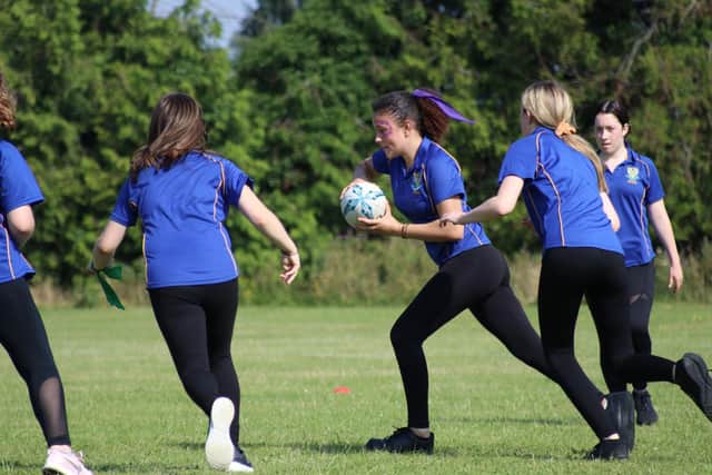 Pupils playing rugby at Stratton Upper School