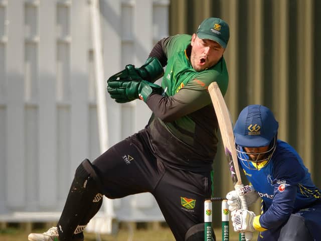 Biggleswade's Sunday firsts' captain and wicketkeeper Gabe Manthorp takes the ball during the game with Flitwick. Photo; Richard Southan.