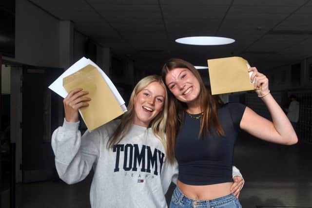 Twins Harriet and Gracie Wall celebrate their results at Samuel Whitbread Academy
