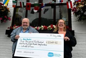 Hugh Hone and Theresa Blunden handover a cheque of more than £2,000 to Sue Ryder