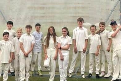 Jake, second right, pictured with fellow youth members of Clifton Cricket Club to promote his cycling fundraiser