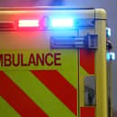 Emergency flashing lights are seen on an ambulance (Photo by Peter Nicholls/Getty Images)