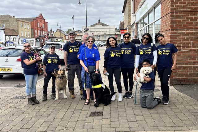 Biggleswade Specsavers staff pictured taking part in a 5k dog walk