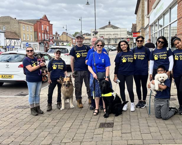 Biggleswade Specsavers staff pictured taking part in a 5k dog walk