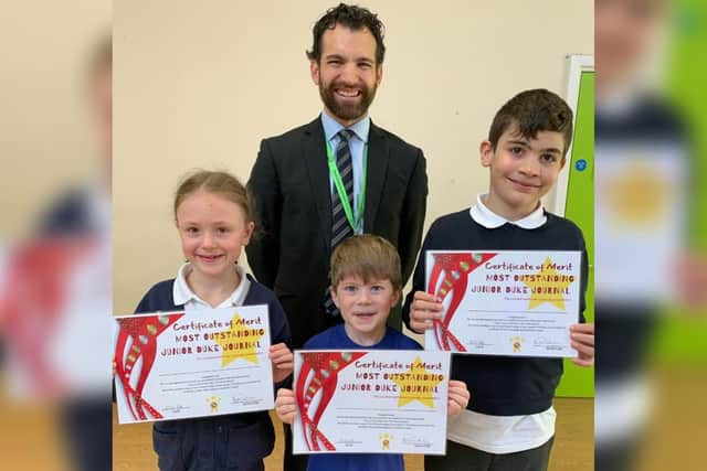 Principal Tom Clarke with pupils (from left) Amber Harrison, Dylan Kourtellis and Evren Binicioglu, who received special certificates of merit at Gothic Mede Academy’s first Mini Duke and Junior Duke Awards graduation ceremony.