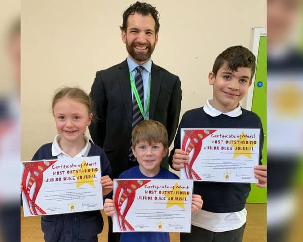 Principal Tom Clarke with pupils (from left) Amber Harrison, Dylan Kourtellis and Evren Binicioglu, who received special certificates of merit at Gothic Mede Academy’s first Mini Duke and Junior Duke Awards graduation ceremony.