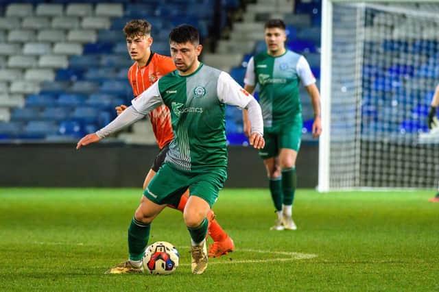 Biggleswade's Michael Simpson in action at Kenilworth Road. Photo: Guy Wills Photography.