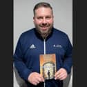 Dan Gaze with his new book, Bouncer Prison School. Image: Dan Gaze.