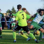 Action from Biggleswade Town's (in dark green) clash with Biggleswade FC. Photo: Guy Wills Photography.