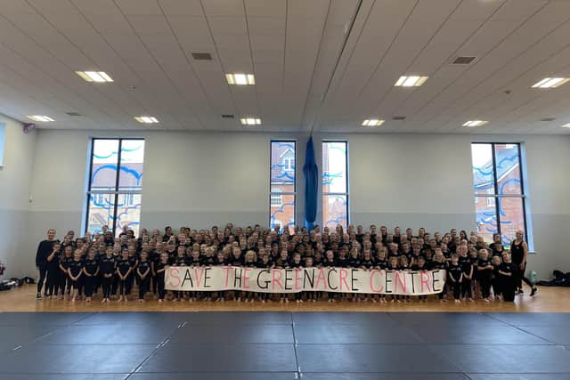 The dance academy pupils pose with their 'Save The Greenacre Centre' banner. Image: Gifford Dance Academy.