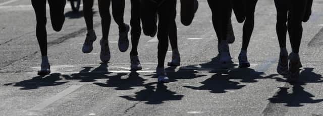 File photo showing a close up of runners. Picture: STAN HONDA/AFP via Getty Images