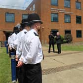 Student officers outside police HQ